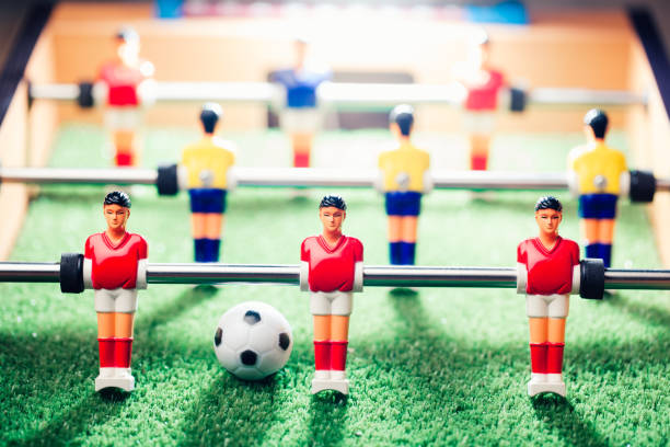 istock table football soccer game players (kicker) 991469034