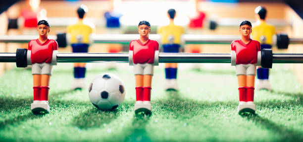 istock table football soccer game players (kicker) 991469254