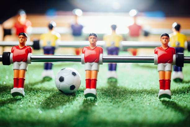 istock table football soccer game players (kicker) 991470288