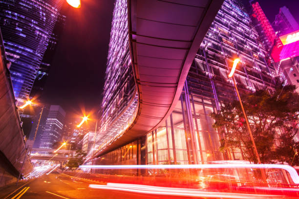 istock moving bus rushing trough Hongkong Business District 991479462