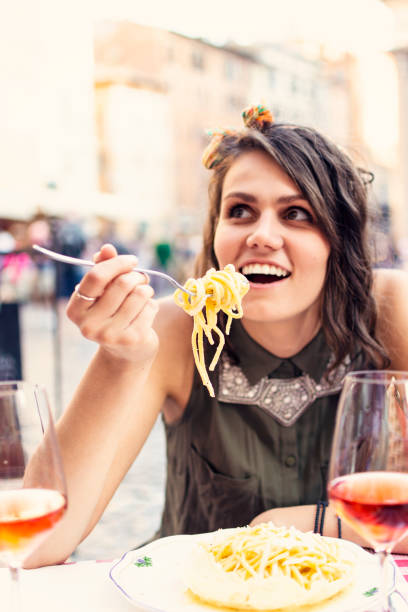 istock Happy woman in a restaurant 991486488