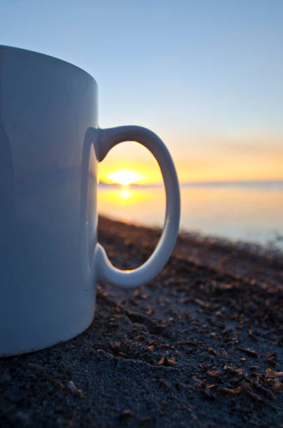 istock The sunset through the handle of the coffee mug 991504556