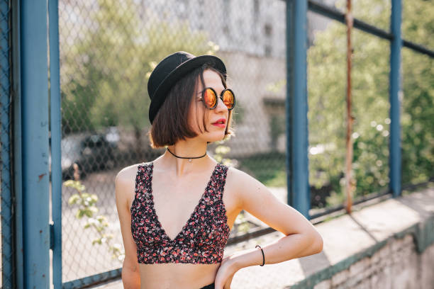 istock Young lady standing in troubled neighborhood 991517290