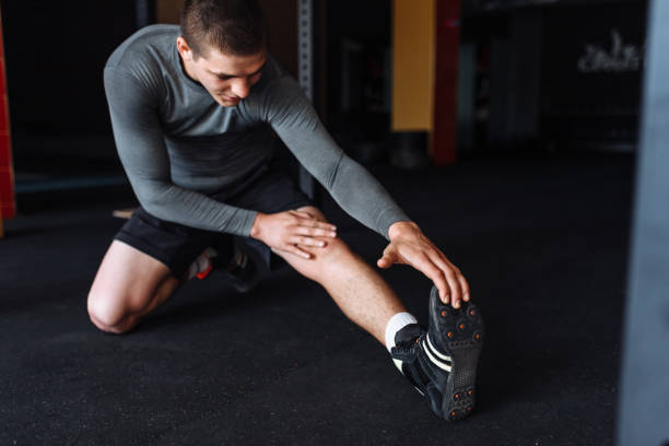 istock Athlete warming up before a workout at the gym, boxer training 991532752