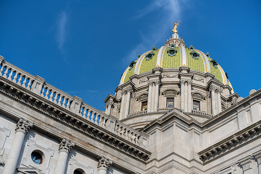 Daylight upward view of the Pennsylvania state capitol building in Harrisburg, PA