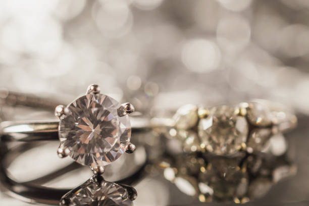 istock Luxury Jewelry diamond rings with reflection on black background 991567888