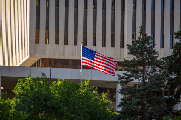 istock American flag blowing gallantly in the wind 991578016
