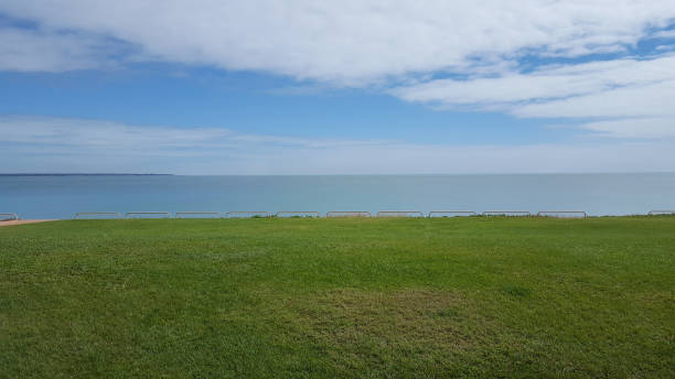 istock Sea beyond the green lawn 991587458