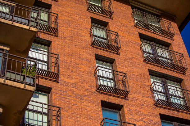 istock Brick on the side of residential building 991588108