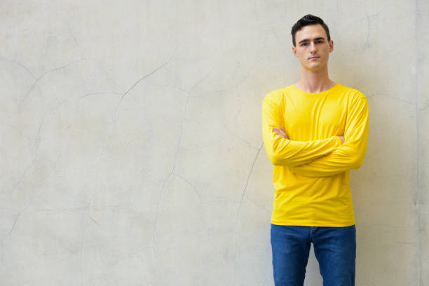 istock Young handsome man with arms crossed 991595016