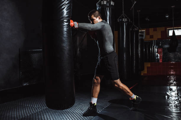 istock Boxer hits a speed bag in the gym, training shock 991595056