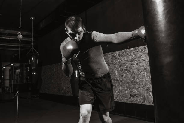 istock Boxer hits a speed bag in the gym, training shock 991595140