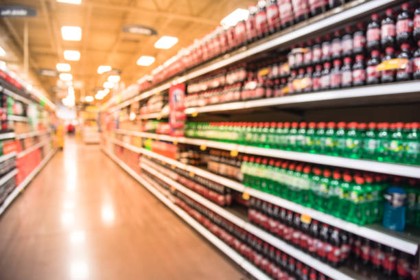 istock Abstract blurred soft drinks aisle in American store 991599384