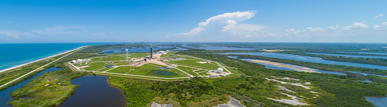 Aerial drone image of a rocket launch platform with nature landscape