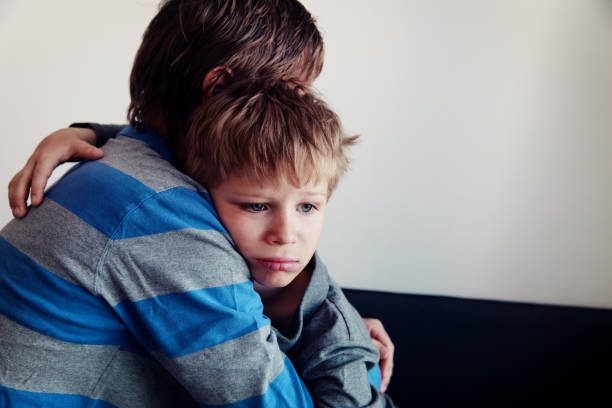 istock Father comforting sad child, parenting, sorrow 991605350