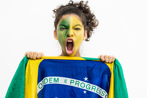 Brazilian supporter holding a brazilian flag