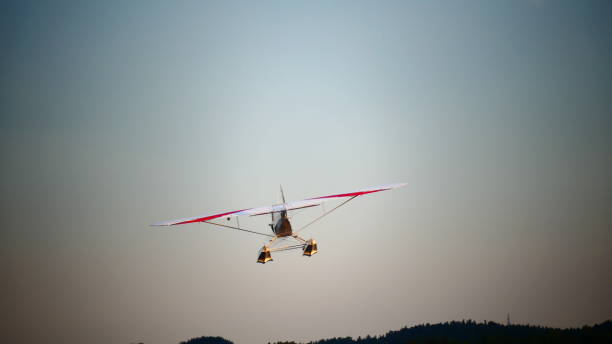 istock Small plane seen from behind in the sky 991616798