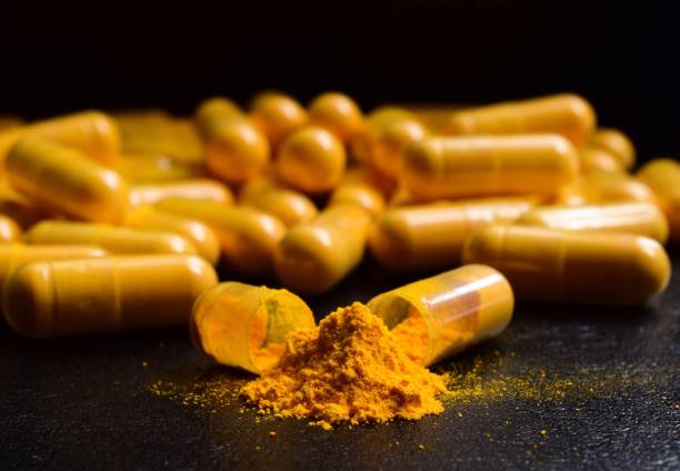 istock Close-Up Of Capsules On Table 991619484