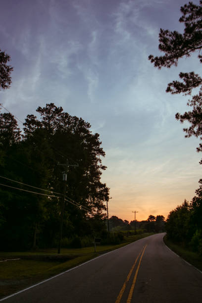 istock Country road in dawn with epic sky 991620060