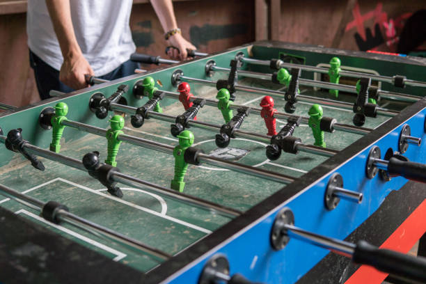 istock Group Of People Playing Soccer On Table 991620456
