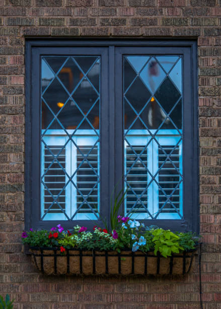 istock Cottage style window with flowers ouside 991633066