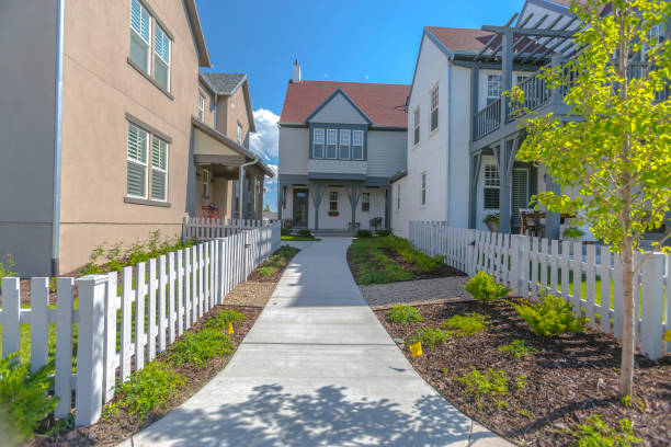 istock Entry way to townhomes with white picket fences 991660696