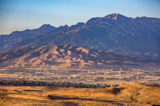 istock Lone Peak and lower mountains at sunset 991705318
