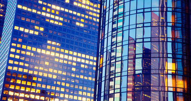 istock Office building at night with reflection and lights 991714752