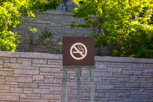 istock No smoking sign near brick wall, centered 991718358