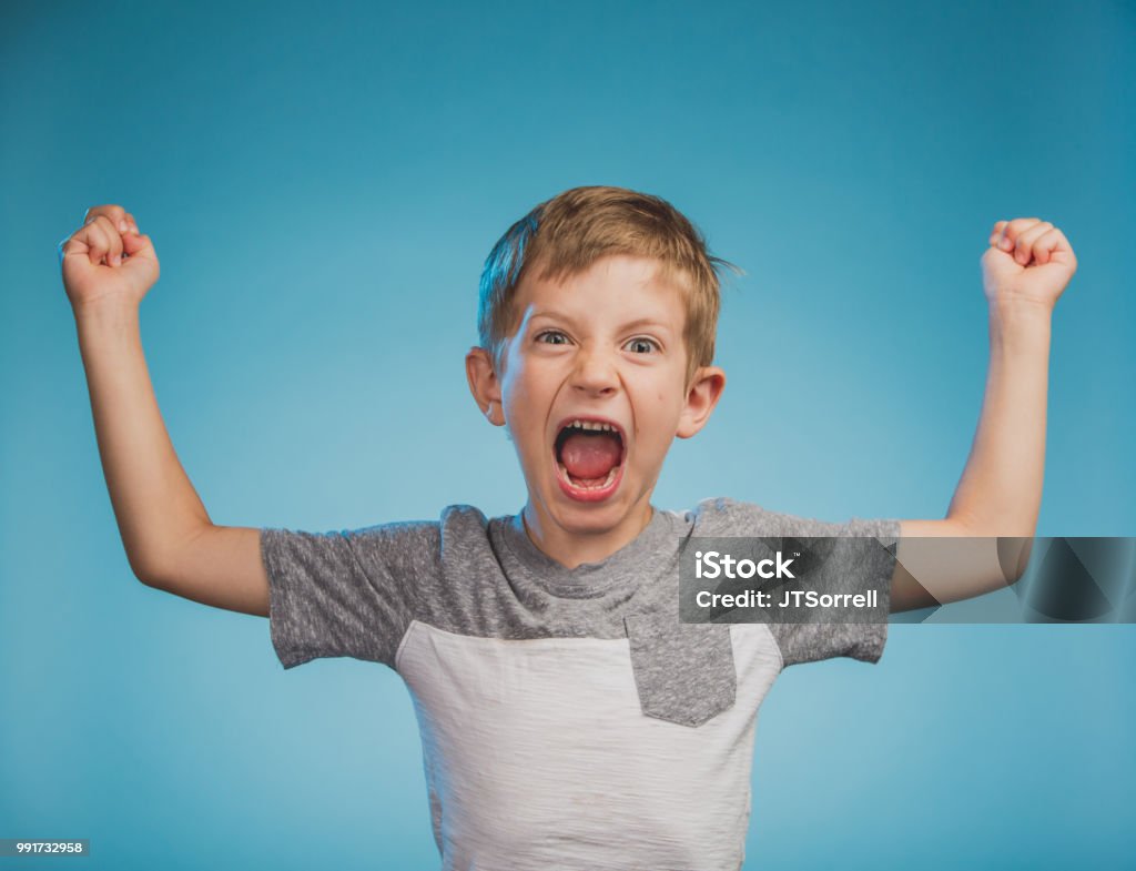 Adorable Little Boy An adorable little boy on a blue background Child Stock Photo