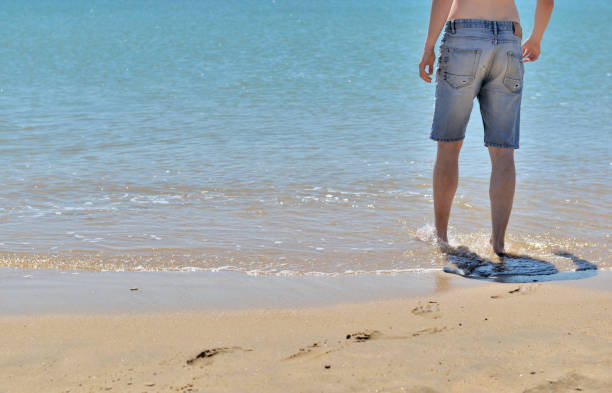 istock feet in the sea 991750024