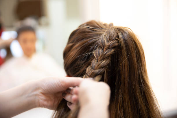 istock Latin woman having hair done 991776642