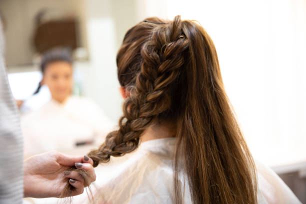 istock Latin woman having hair done 991791242