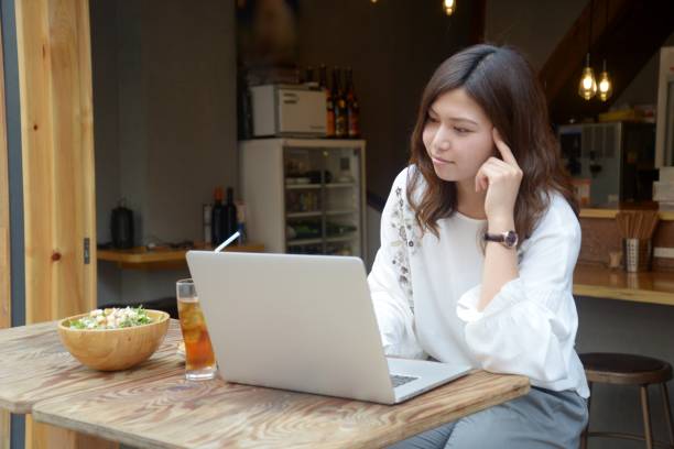 istock Woman working with a laptop at a bar 991792518