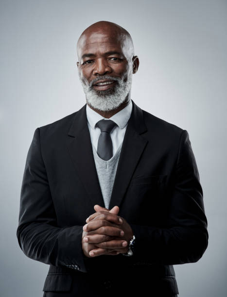 With unfaltering dedication, you can go far too Studio portrait of a mature businessman against a grey background beard photos stock pictures, royalty-free photos & images