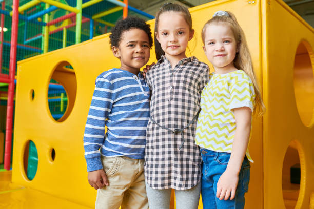 istock Group of Kids Posing in Play Area 991816698