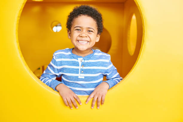Happy Boy Playing in Play Area