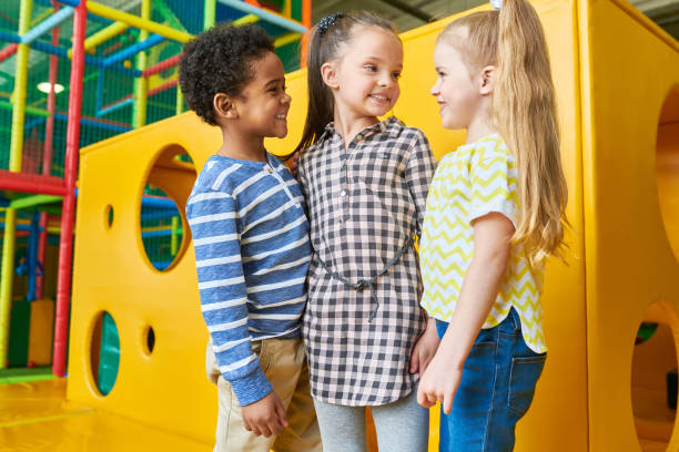 istock Group of Happy Kids Posing in Play Area 991816730