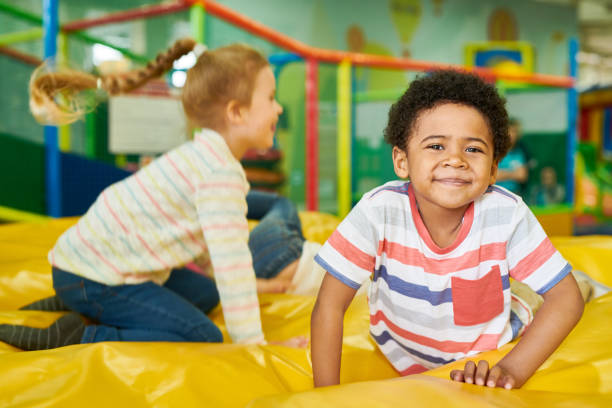 istock Cute Little Kid in Bouncy Castle 991816738