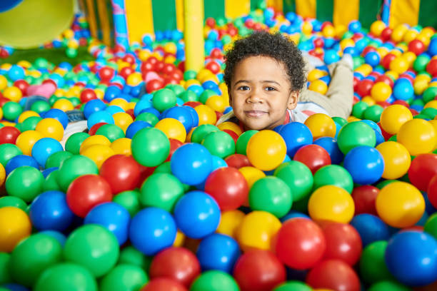 istock Cute Little Boy Playing in Ballpit 991816766