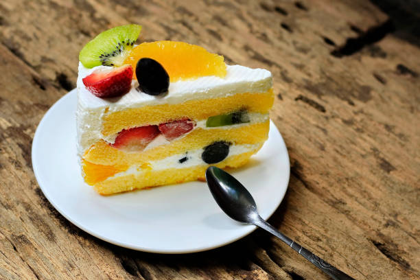 istock Cake Fruity Cake on Old Wood Floor. 991820160