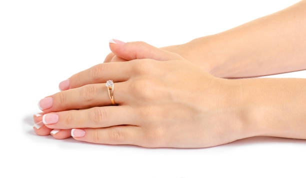 istock Female hand with a gold ring 991825146