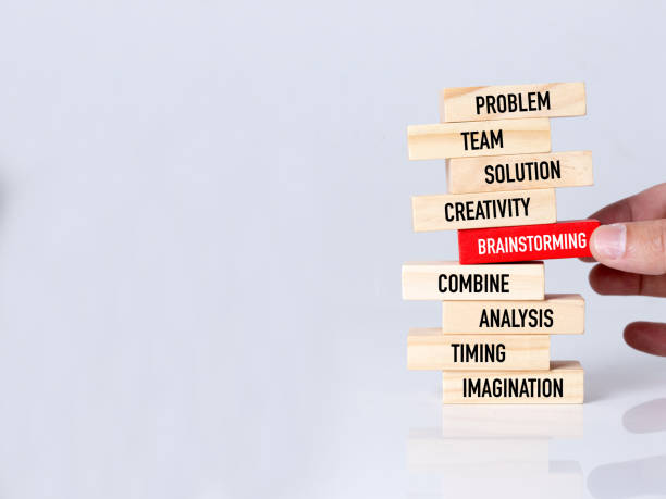 istock Businessman Building BRAINSTORMING Concept with Wooden Blocks 991829232