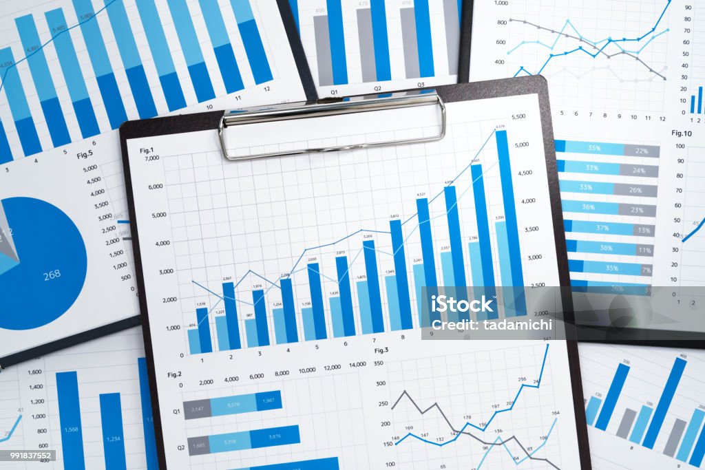 Pile of statistical business reports. Many growth charts. Gathering and analyzing data. Data Stock Photo