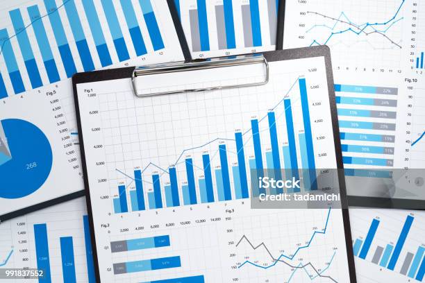 Pile Of Statistical Business Reports Stock Photo - Download Image Now - Data, Graph, Chart