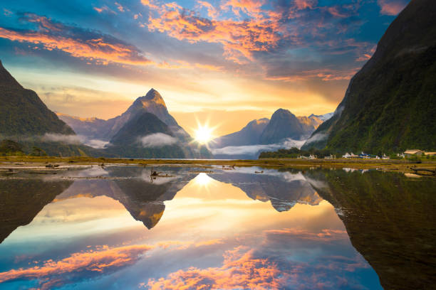 The Milford Sound fiord. Fiordland national park, New Zealand Famous Mitre Peak rising from the Milford Sound fiord. Fiordland national park, New Zealand milford sound stock pictures, royalty-free photos & images