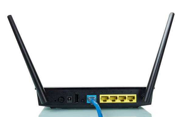 istock Wi-Fi router and Internet connection cable isolated on white 991838414