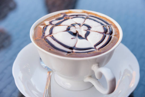 istock Relax time with hot cappuccino coffee in coffee cafe 991848874
