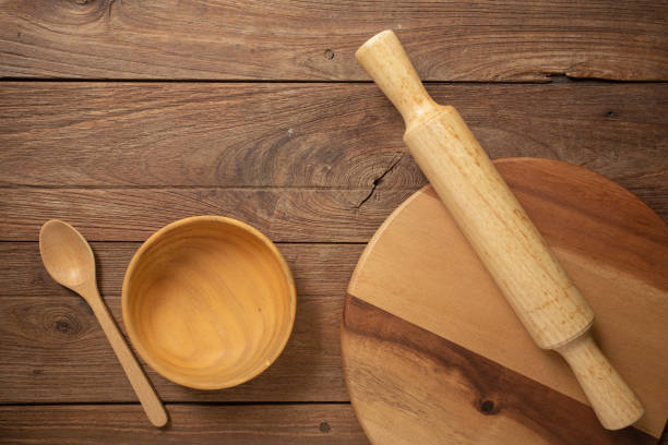istock Wooden cookware on Dark old wooden table texture background top view 991853556
