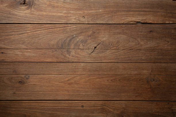 istock Dark old wooden table texture background top view 991853572